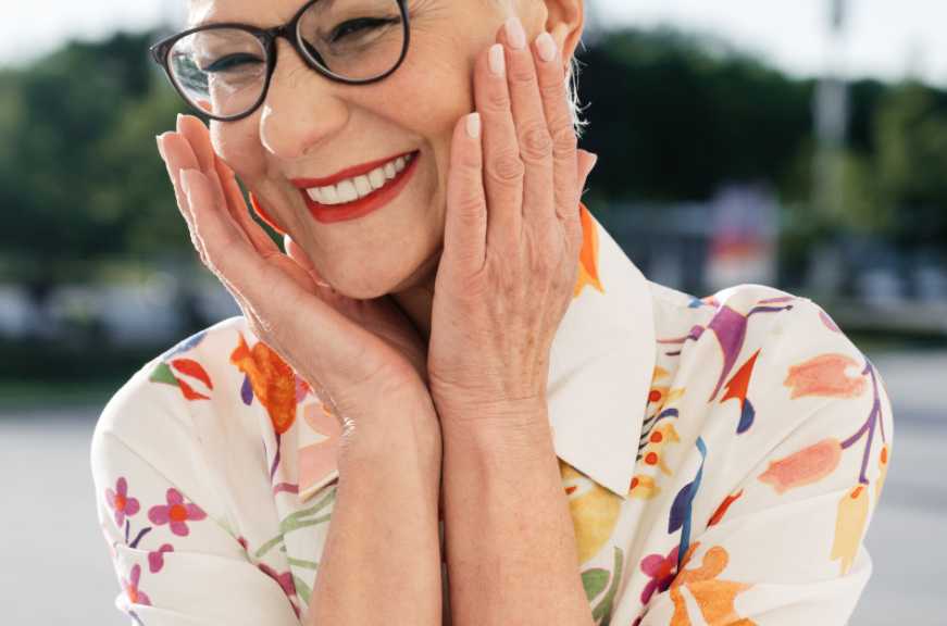 Senior woman with glasses smiling